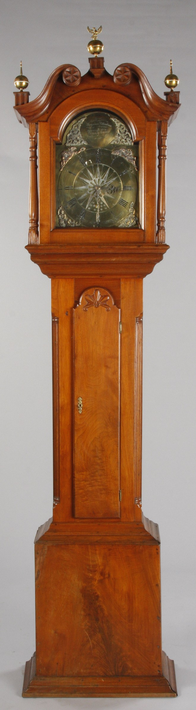 Walnut Chippendale case with broken arch pediment carved rosettes brass