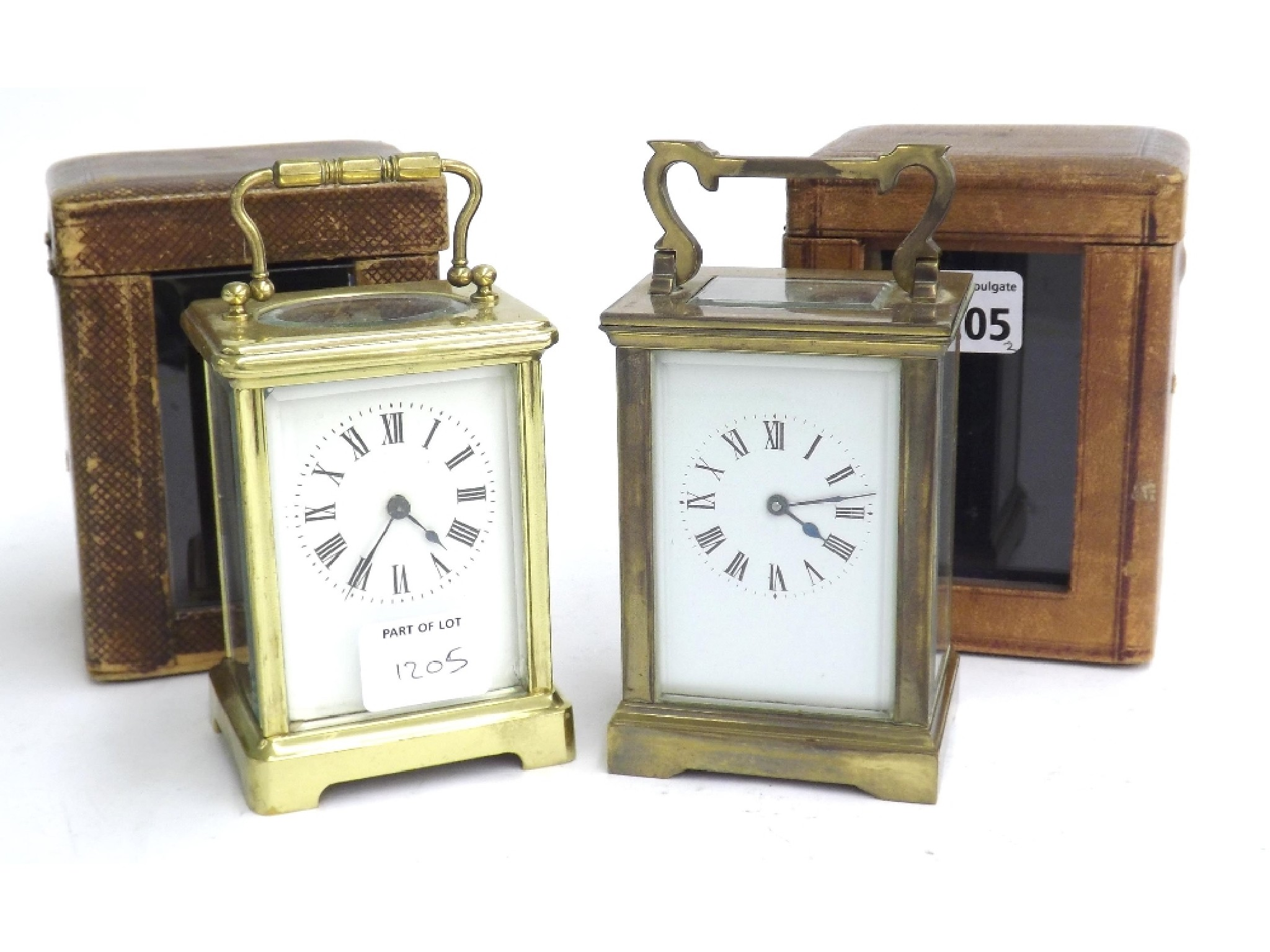 Two carriage clock timepieces within corniche brass cases both 6