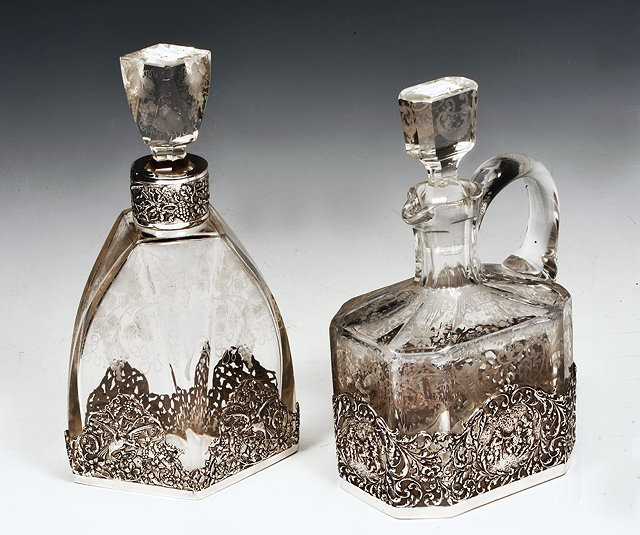A CONTINENTAL ETCHED GLASS JUG with silver 925 mounts within
