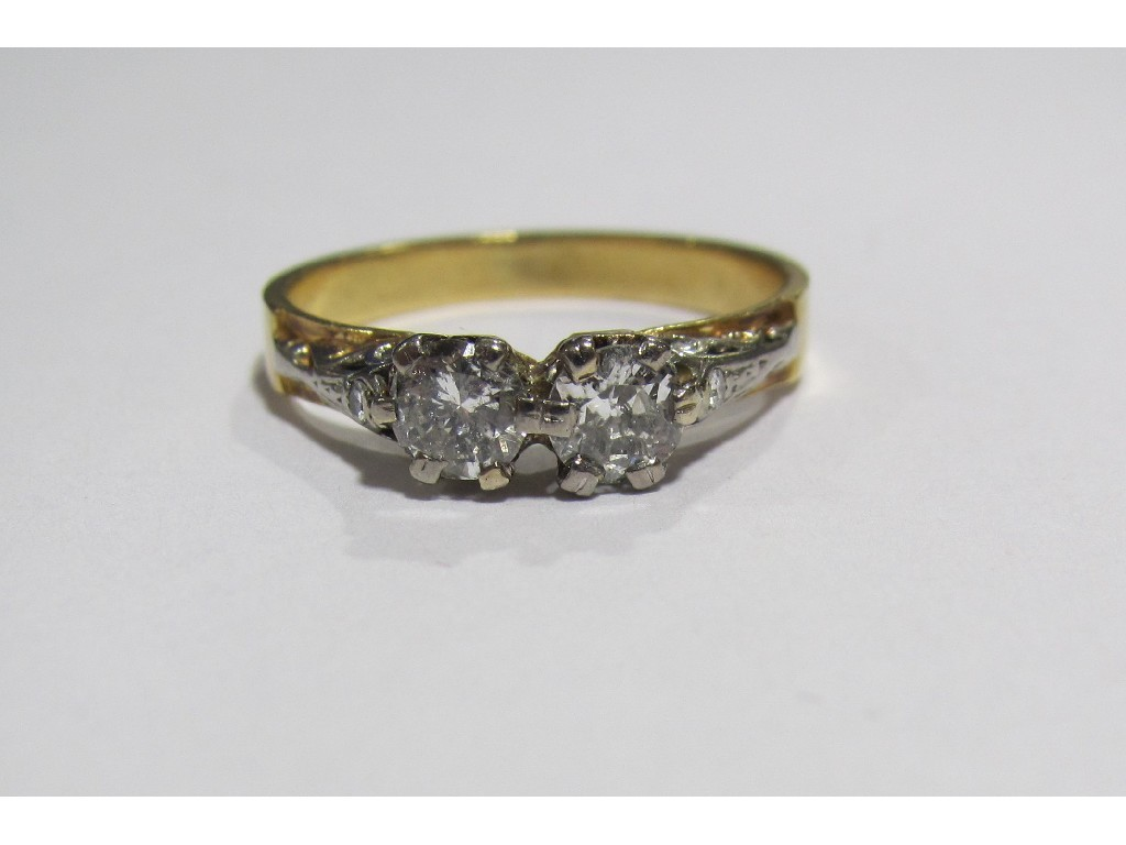 Eighteen carat gold twin stone diamond set dress ring with