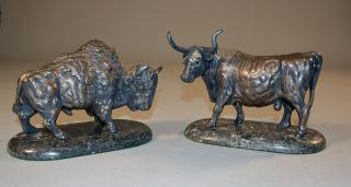 Two sterling figures of a bison and a steer mounted