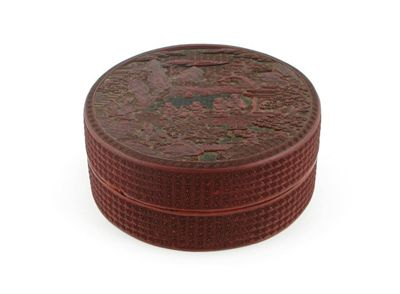 A Chinese red and black cinnabar lacquer circular box and