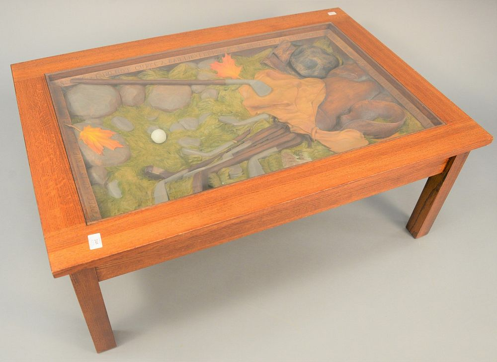 Carved golf etiquette coffee table having carved interior with glass