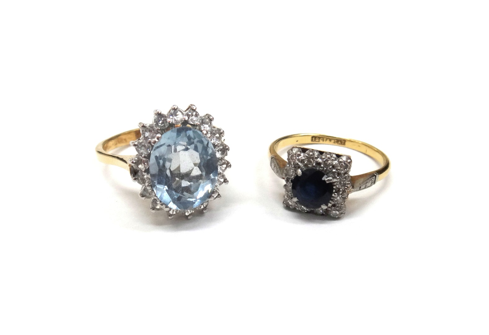 A gold sapphire and diamond square cluster ring detailed 18ct