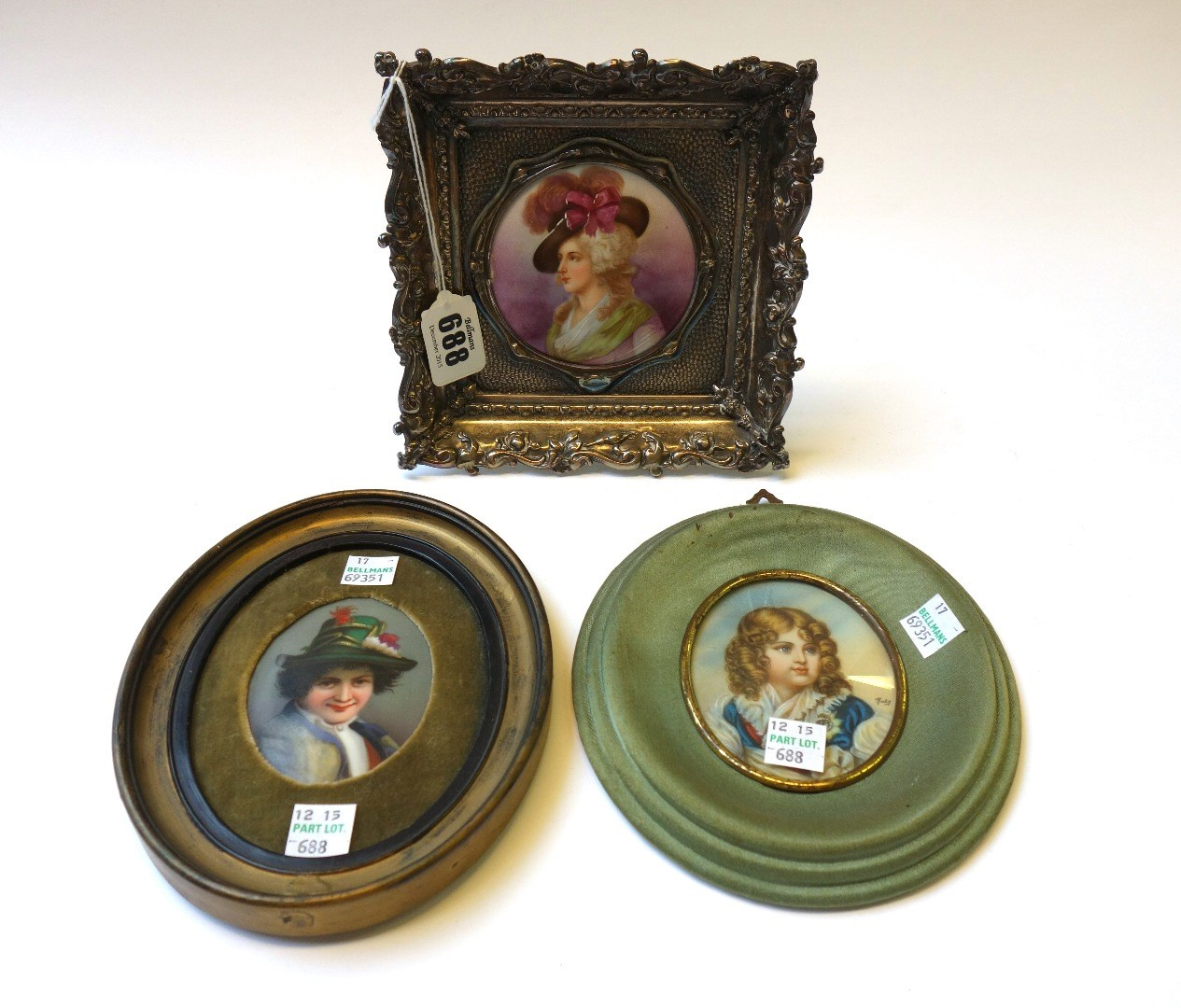 A Continental porcelain miniature circular plaque depicting a Victorian lady