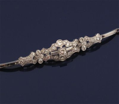 A diamond bracelet The graduated circular and baguette shaped diamonds