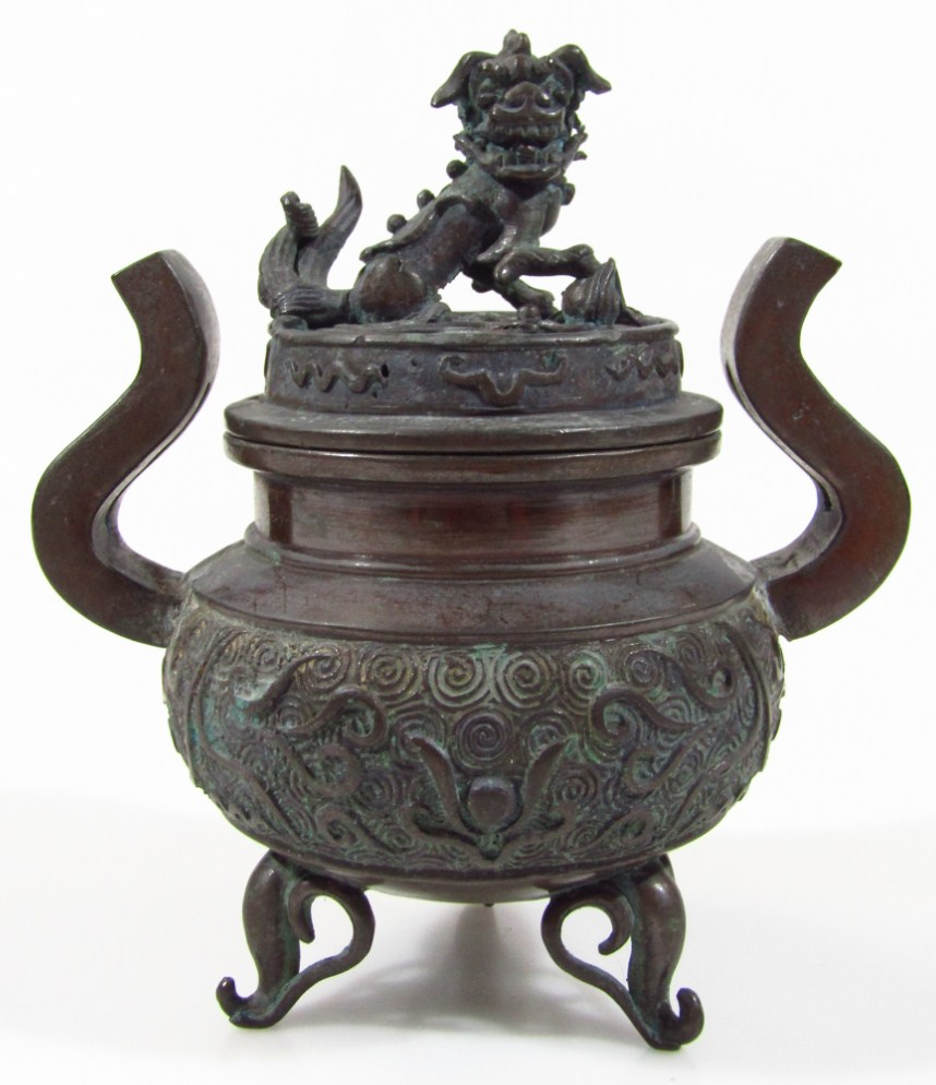A 19thC Chinese bronze censer of compressed circular form with