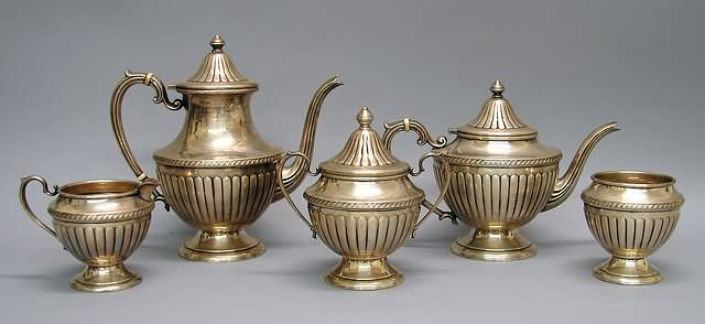 Fluted urn form with urn finials and circular base consisting