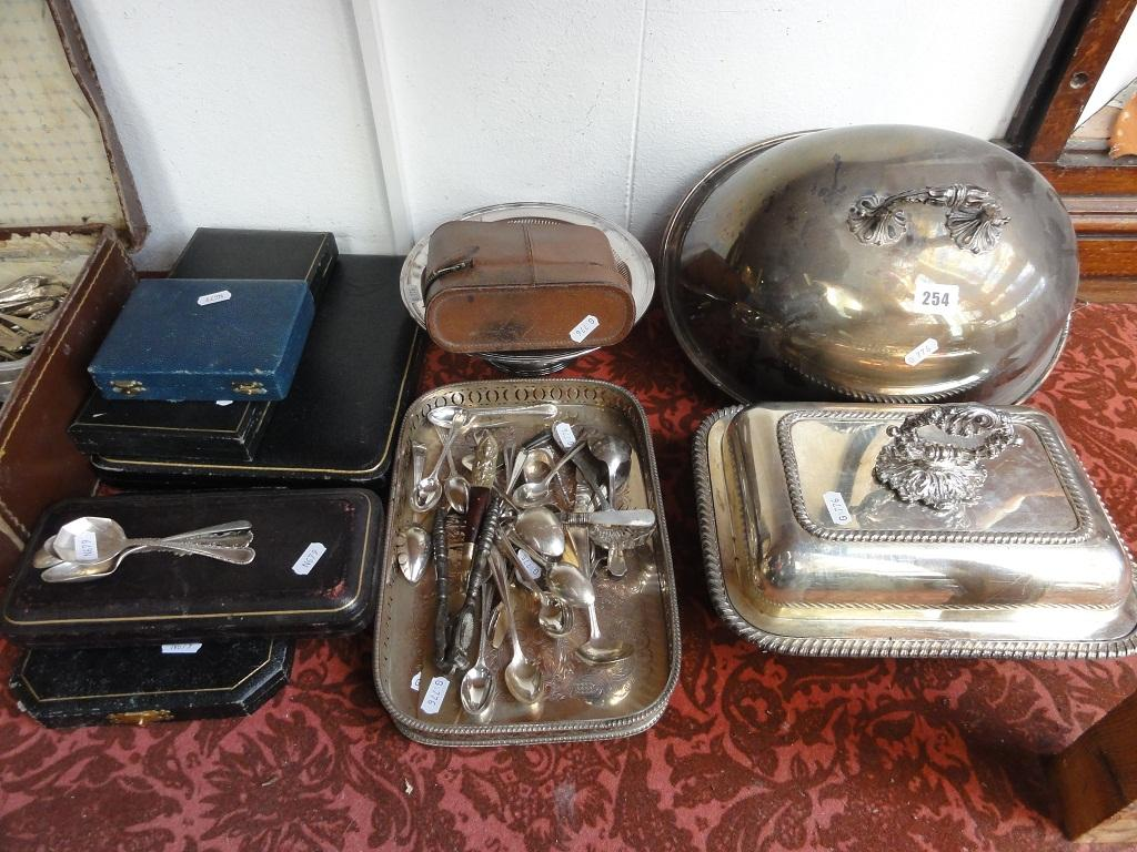 A silver plated meat cover of oval form together with