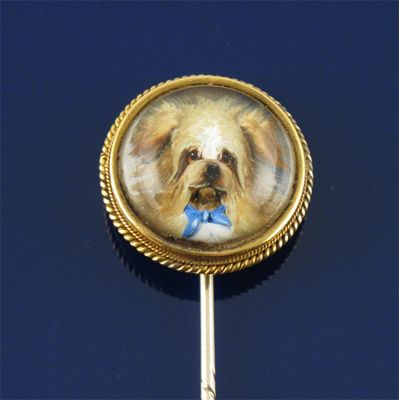 A late 19th century reverse carved crystal gold stick pin