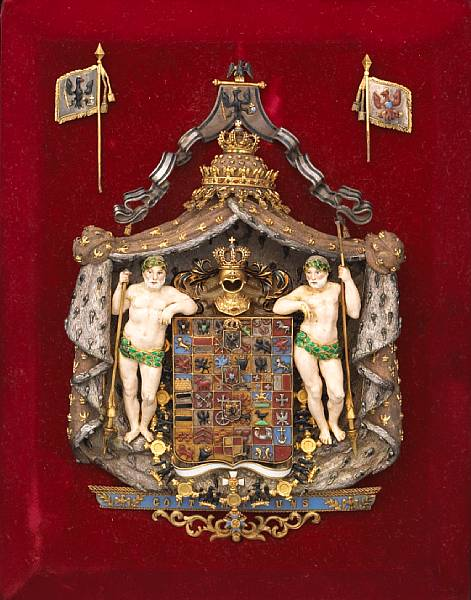 A German silver gilt and enamel armorial badge displaying the