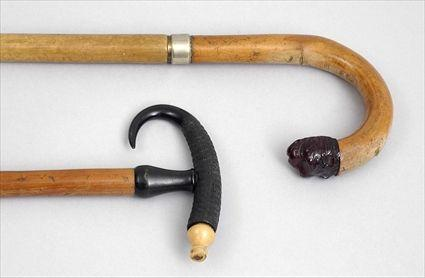 FRUITWOOD CANE AND A HORN HANDLED SOUVENIR CANE The first