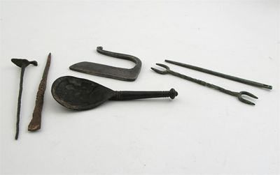 Artifacts a base metal knop spoon with a crude animal