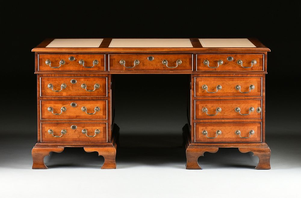 A GEORGE II STYLE WALNUT CREAM LEATHER TOP PARTNER S