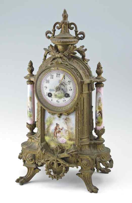 FRENCH CAST METAL AND PORCELAIN MANTLE CLOCK Cast metal case