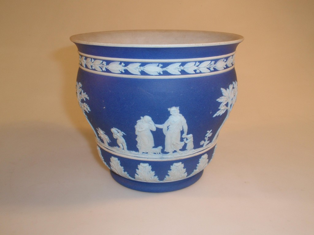 A Wedgwood blue jasper cachepot of ogee form sprigged with