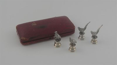 A set of four cast game bird menu holders set
