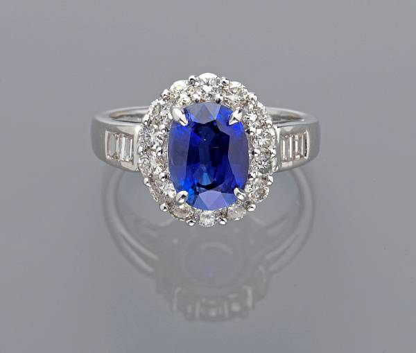 A sapphire and diamond ring mounted in eighteen karat white