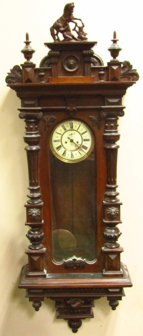 A 19thC walnut cased Vienna wall clock by Gustav Becker
