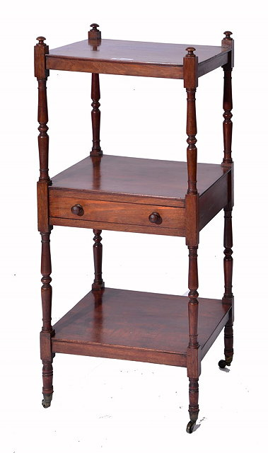 A REGENCY MAHOGANY THREE TIER WHATNOT with baluster turned columns