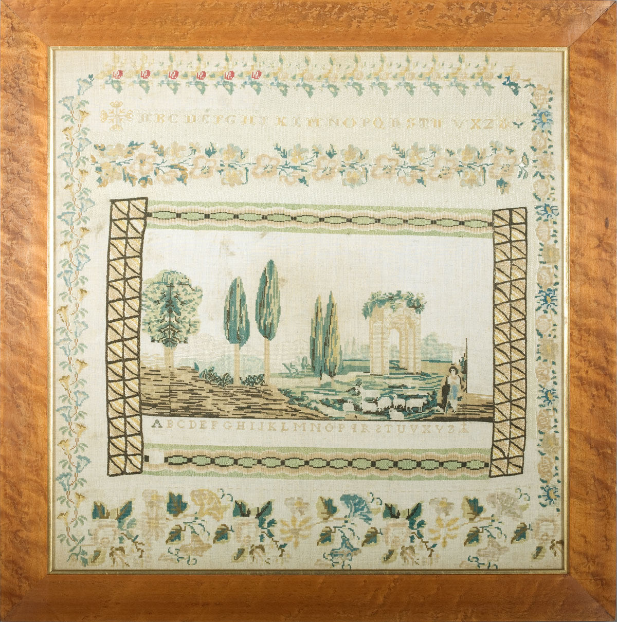 ELABORATE EUROPEAN SAMPLER With central landscape scene two alphabets and