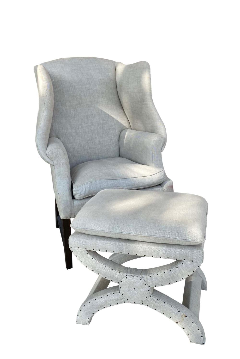 GEORGE III STYLE LINEN UPHOLSTERED WING CHAIRThe rectangular back and