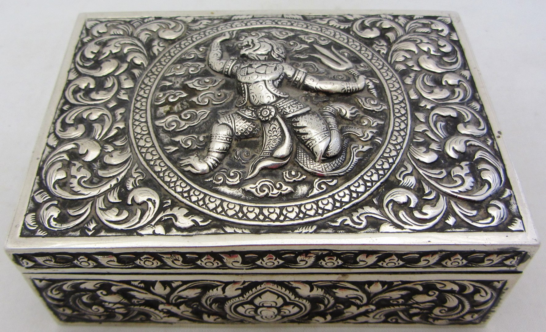 An Eastern rectangular hinge lidded table cigarette box wooden lined