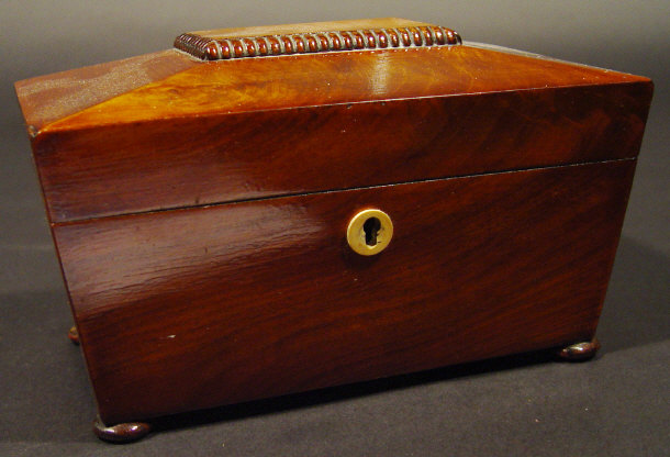 19th Century mahogany sarcophagus shaped tea caddy with hinged lid