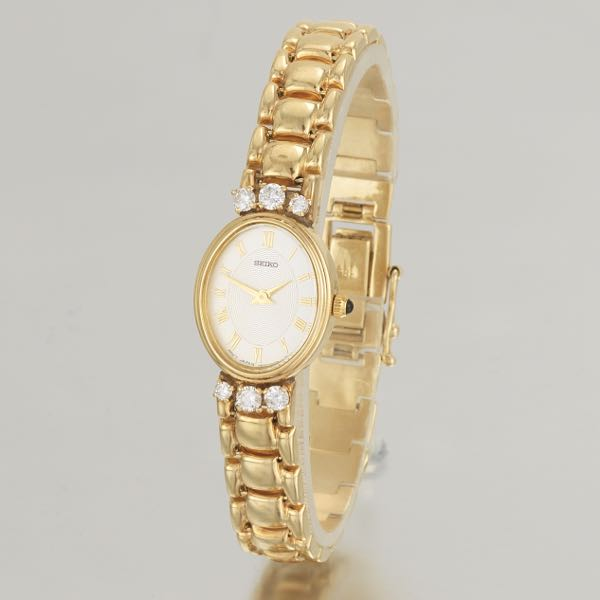 SEIKO 14K LADIES GOLD AND DIAMOND WATCH 7 long White