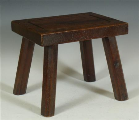 A small vernacular yew wood stool with rectangular top standing