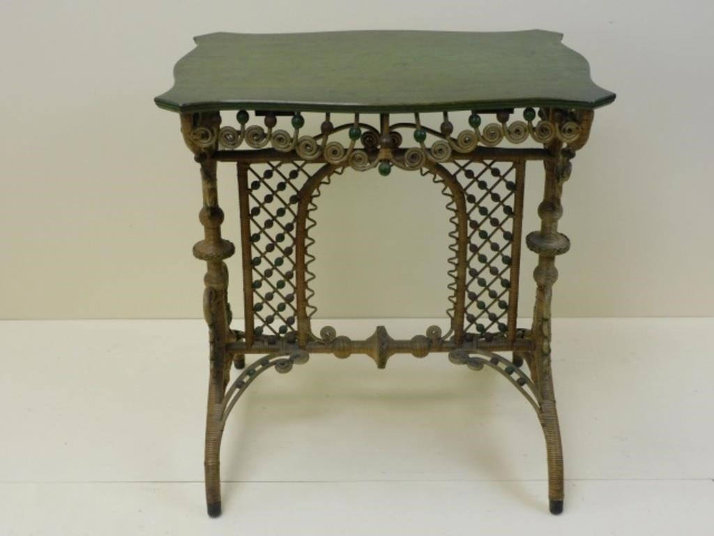 Rattan and wood with a shaped top elaborate beaded curlicued
