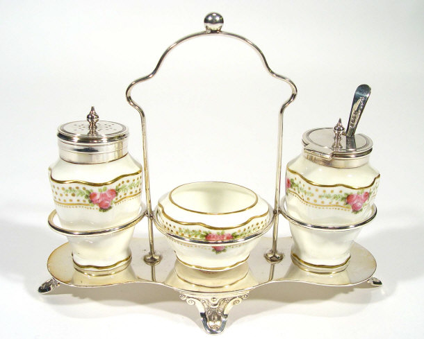 George Jones three piece china cruet set hand coloured and