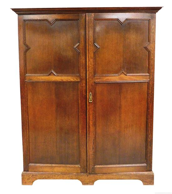 Jacobean style two door armoire with fitted interior c 1900