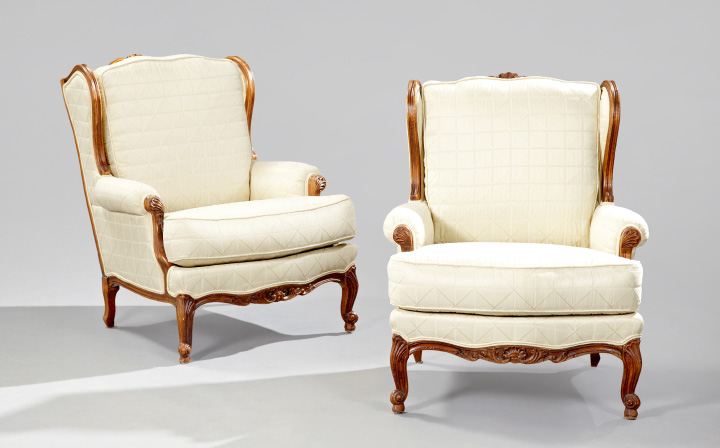 Handsome Pair of Louis XV Style Carved Fruitwood Bergeres each