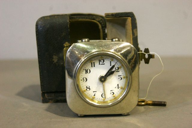 A French late 19th century silver plate travelling clock in