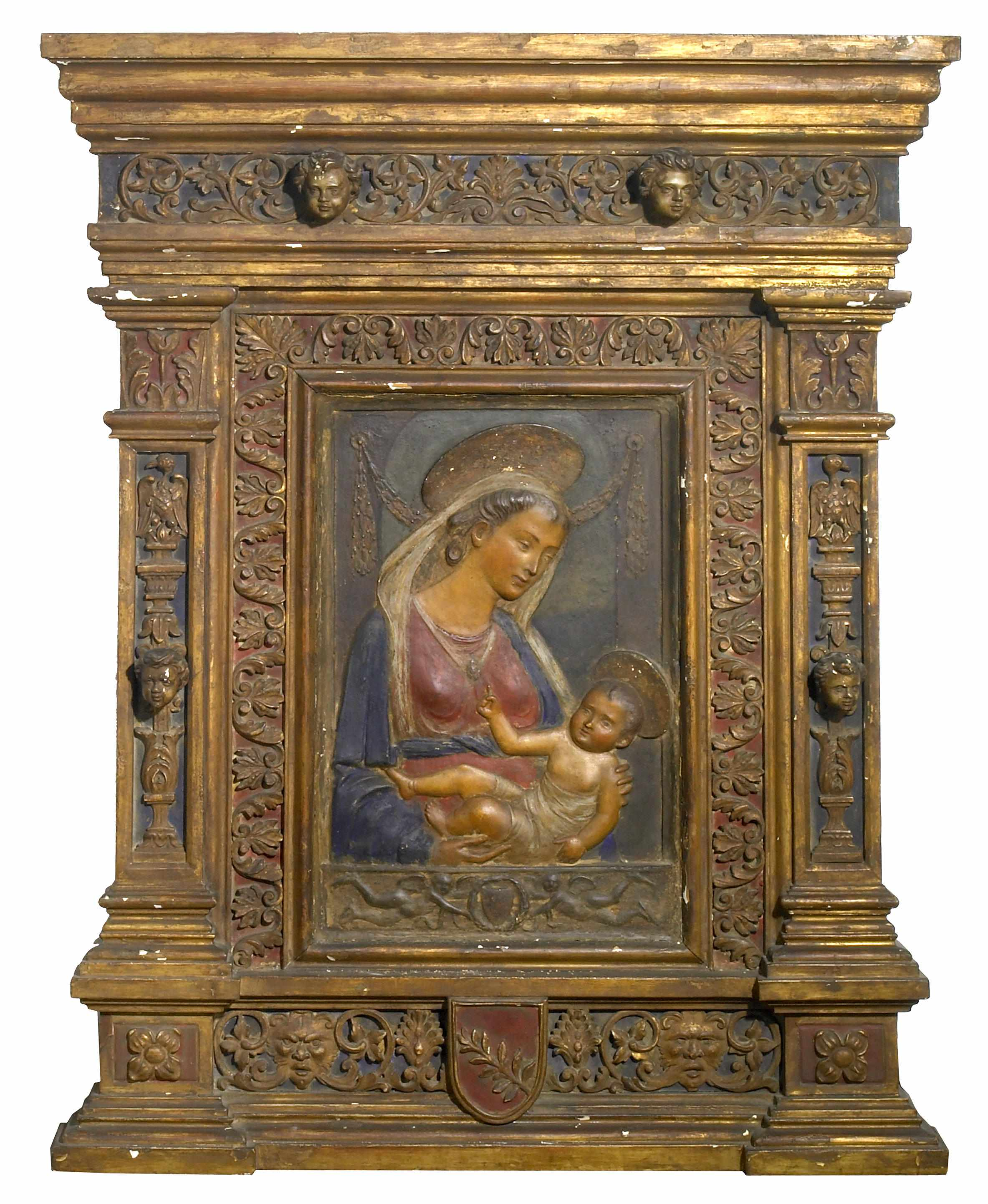 An Italian Renaissance polychrome decorated plaster relief of the Virgin