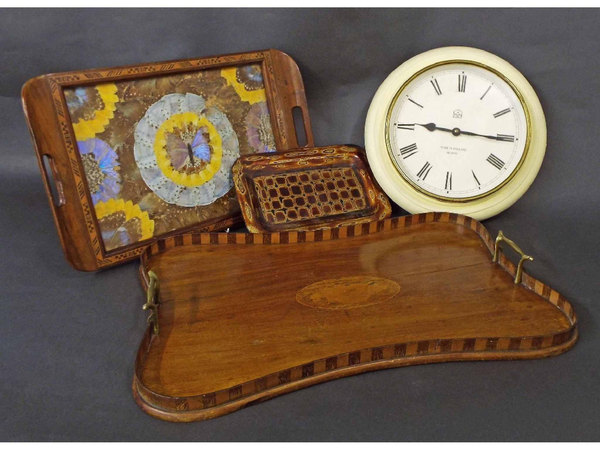 Edwardian serpentine mahogany gallery tray with raised parquetry borders centrally