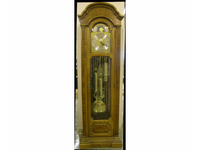 Howard Miller Grandfather clock in oak case sun and moon