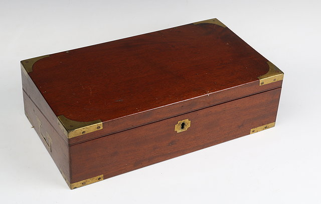 A 19TH CENTURY MAHOGANY AND BRASS BOUND TRAVELLING WRITING BOX