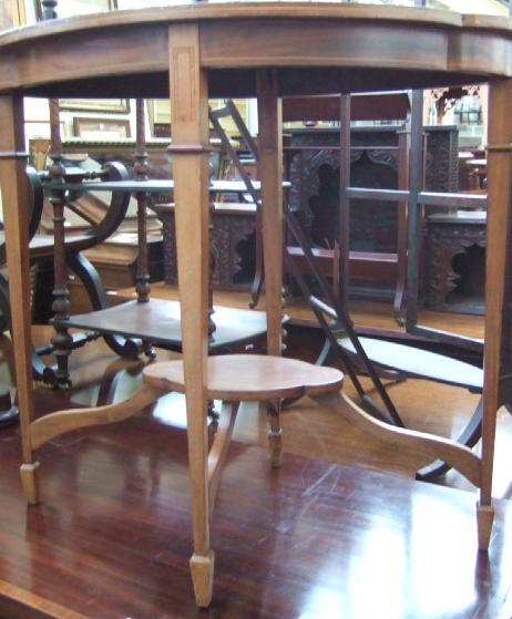 An Edwardian mahogany inlaid two tier occasional table of quadralobe