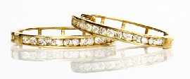 A pair of 9ct gold diamond hoop earrings estimated total