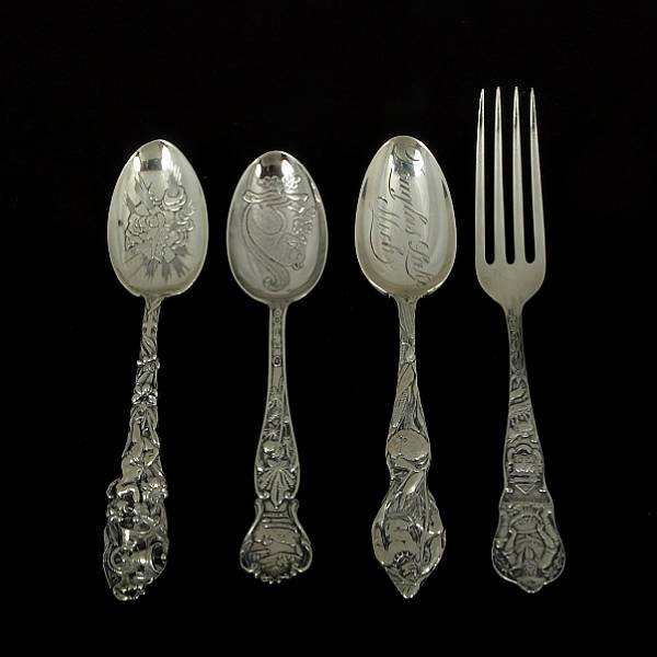 A group of sterling souvenir flatware Comprising 20 teaspoons and