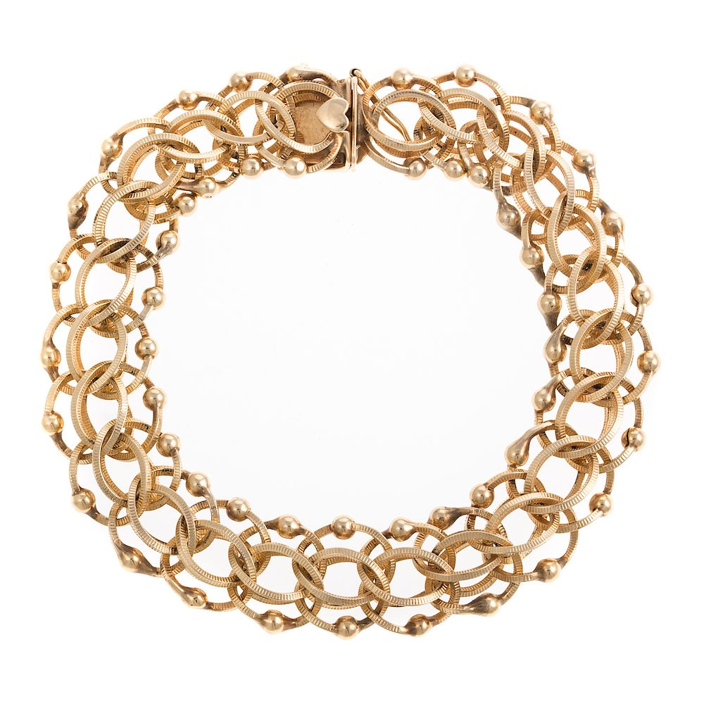 A Lady s Wide Link Charm Bracelet in 14K 14K