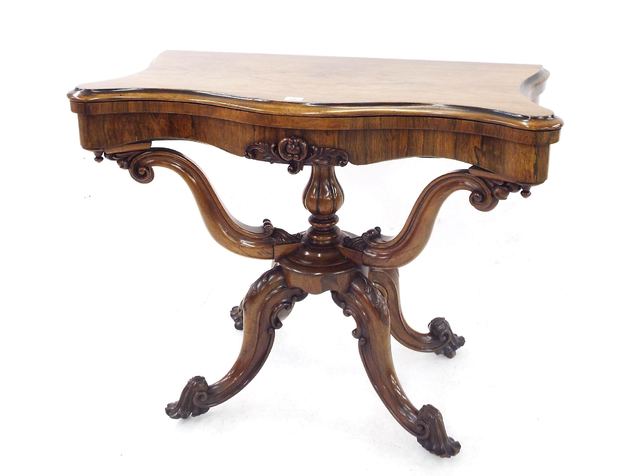 Good Victorian rosewood serpentine games table the hinged lid enclosing