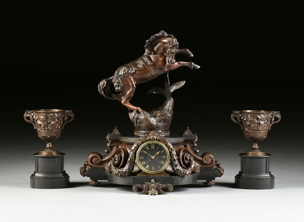 A BAROQUE REVIVAL THREE PIECE PATINATED METAL REARING HORSE AND