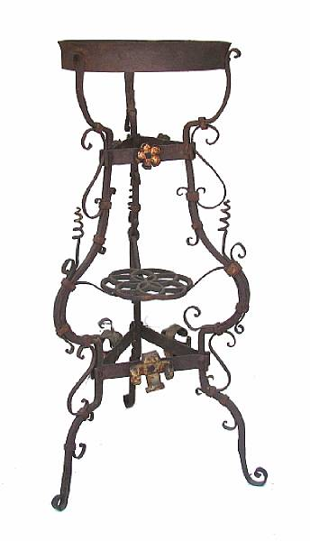 A Victorian wrought metal jardiniere stand height 28in