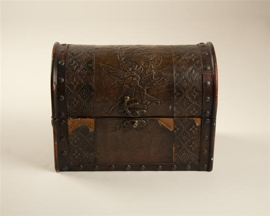 A Dome Top Tabletop Chest of wood covered with brass