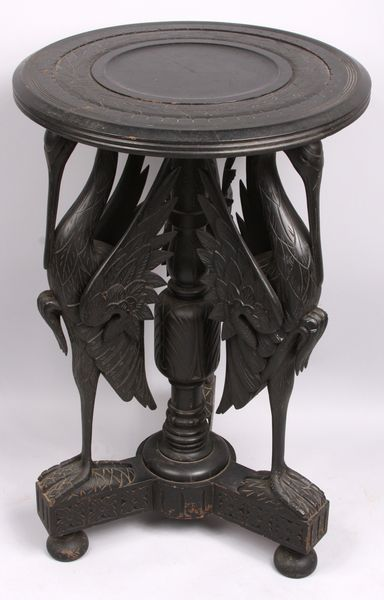 Carved ebonized wood stand with stork motif 33 1 4