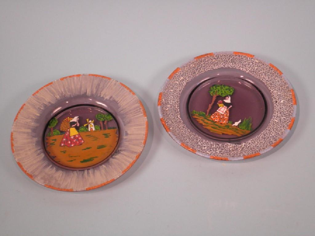 Two similar 1920s Art Glass plates each decorated with female