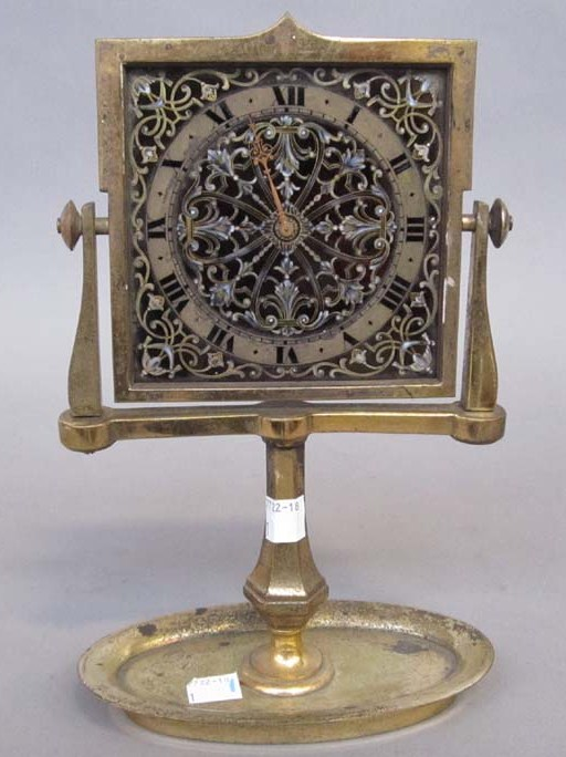 ANTIQUE SWISS DESK CLOCK Enamel face clock is on a